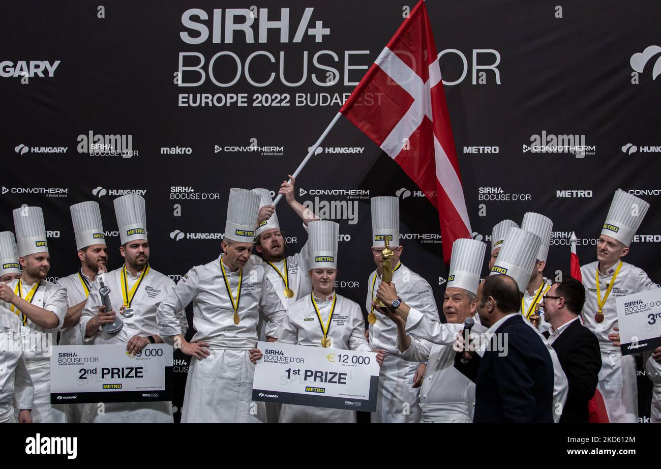 Chef Régis Marcon as a three stars by the Guide Michelin owner gives the trophy to Team Denmark who won the 1st place on Bocuse d’Or Europe 2022 - Day 2 on March 24, 2022 at Hungexpo in Budapest, Hungary. (Photo by Robert Szaniszló/NurPhoto) Stock Photo