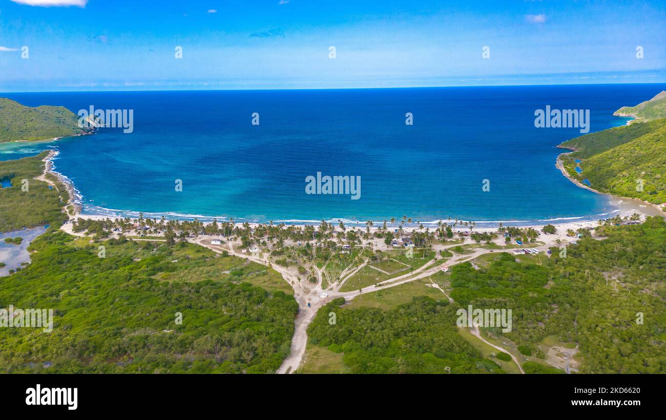 An aerial view of the beautiful sunny Bahia de Patanemo beach in Puerto
