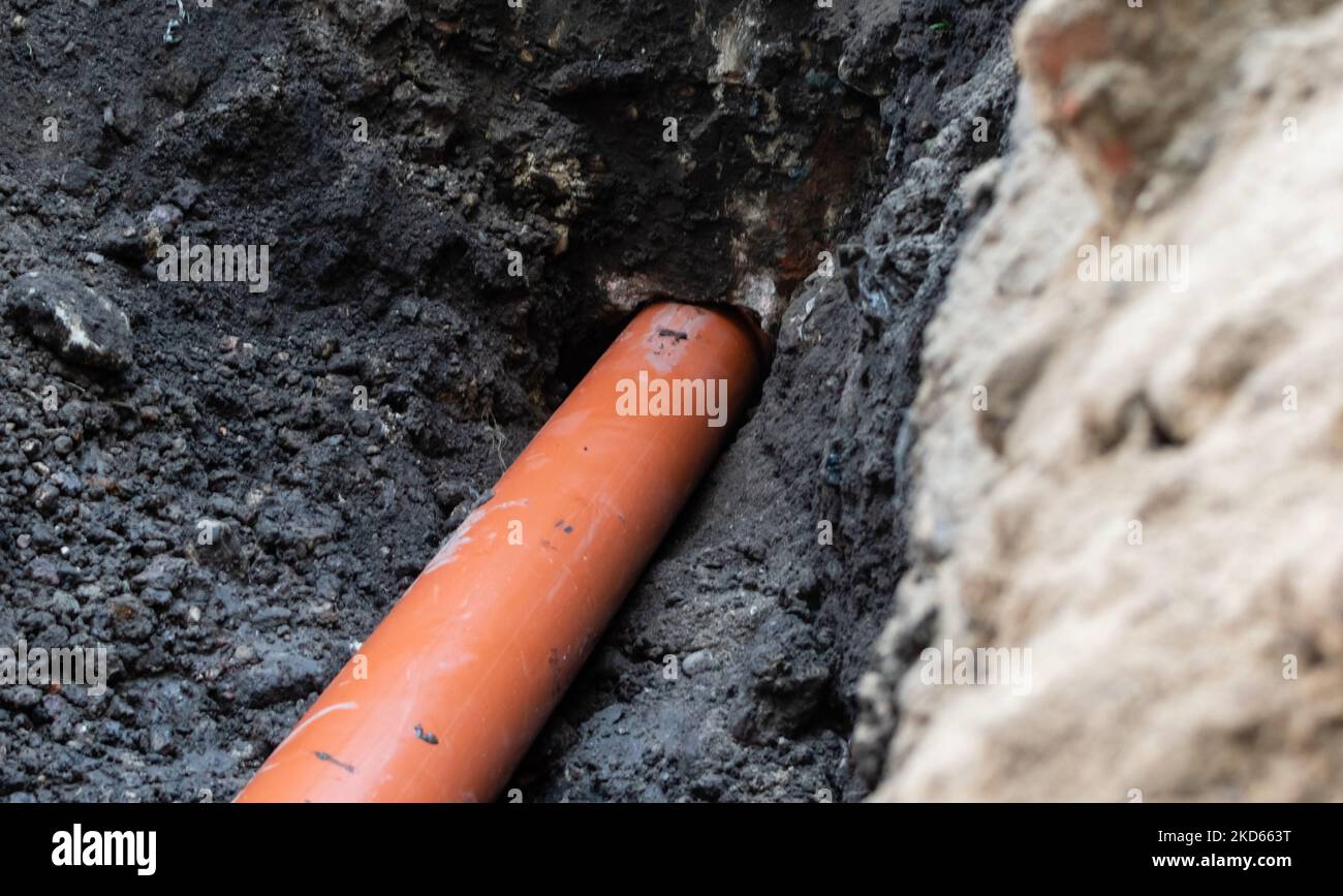 Repair of sewer drain with strong plastic pipe of large diameter in