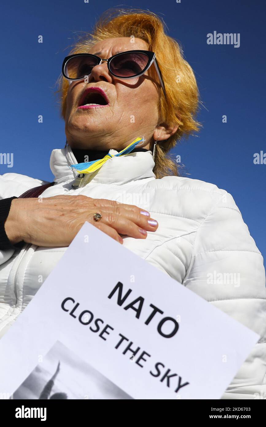 A woman attends a demonstration of solidarity with Ukraine demanding NATO to close the sky for Russian planes over the territory of Ukraine following Russian invasion. Krakow, Poland on March 27, 2022. (Photo by Beata Zawrzel/NurPhoto) Stock Photo