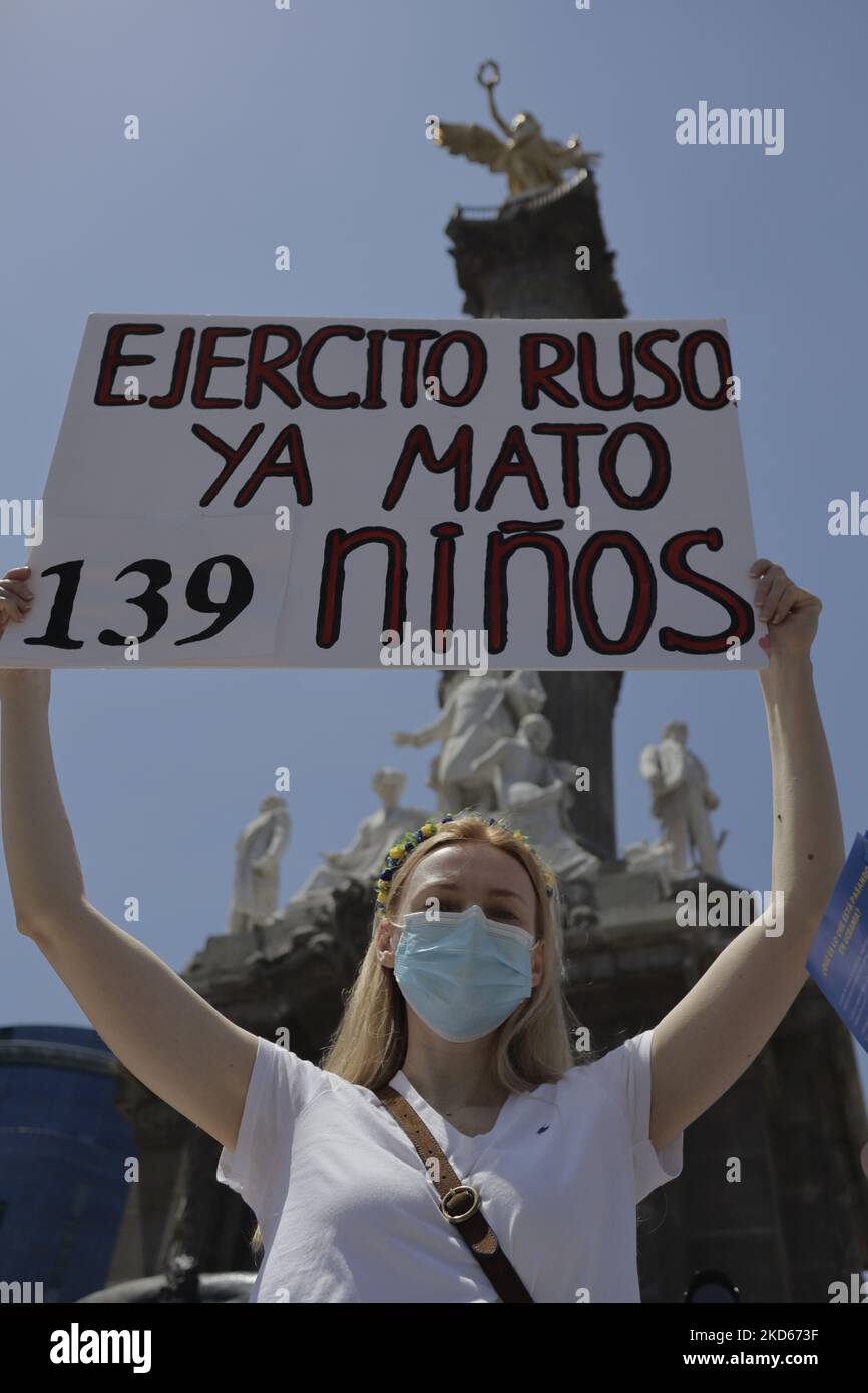 A woman from the Ukrainian community in Mexico City holds a banner while demonstrating at the Angel de la Independencia column against Russian President Vladimir Putin, after he ordered the start of a military strategy in several Ukrainian cities. (Photo by Gerardo Vieyra/NurPhoto) Stock Photo