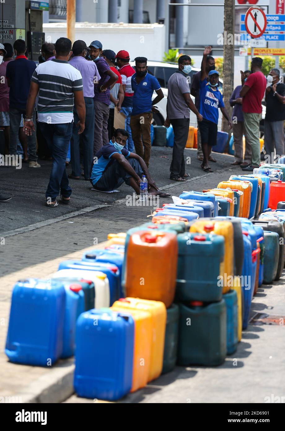 Sri Lankan People waite to buy diesel fuel at a fuel station in Colombo