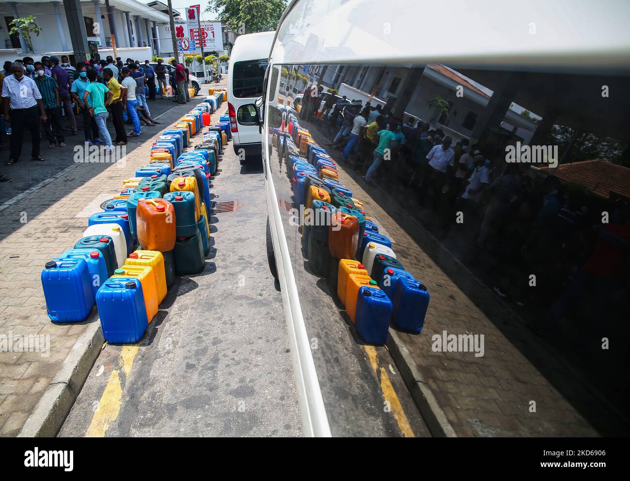 Sri Lankan People waite to buy diesel fuel at a fuel station in Colombo