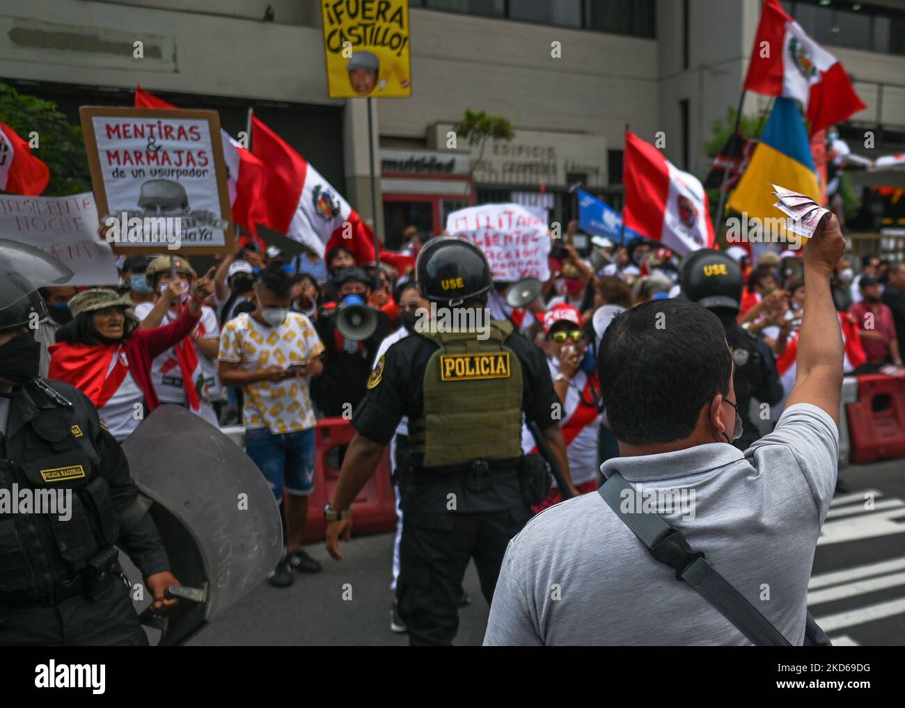 Peruvian Riot Armor Riot Police separe protesters against Peruvian President Pedro Castillo ...