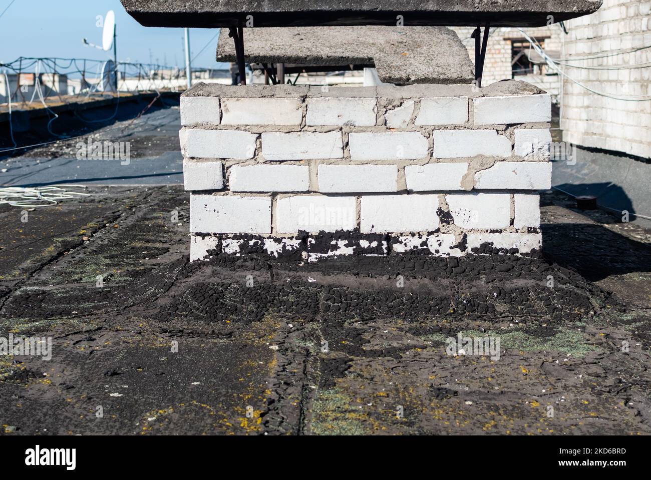 Image showcasing Repair of roof of multi-storey building with a waterproofing covering ...