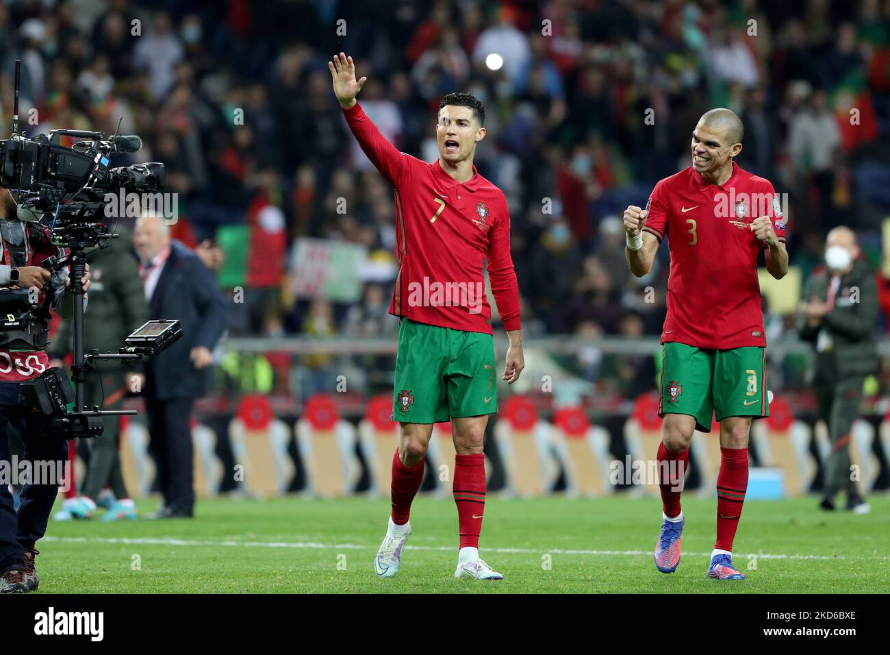 Portugal's forward Cristiano Ronaldo (L ) and Pepe celebrate the victory at the end of the 2022 FIFA World Cup Qualifier football match between Portugal and North Macedonia at the Dragao stadium in Porto, Portugal, on March 29, 2022. (Photo by Pedro FiÃºza/NurPhoto) Stock Photo