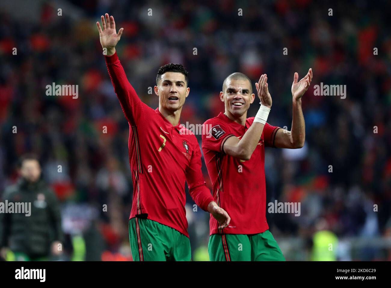 Portugal's forward Cristiano Ronaldo (L) and Pepe celebrate the victory at the end of the 2022 FIFA World Cup Qualifier football match between Portugal and North Macedonia at the Dragao stadium in Porto, Portugal, on March 29, 2022. (Photo by Pedro FiÃºza/NurPhoto) Stock Photo