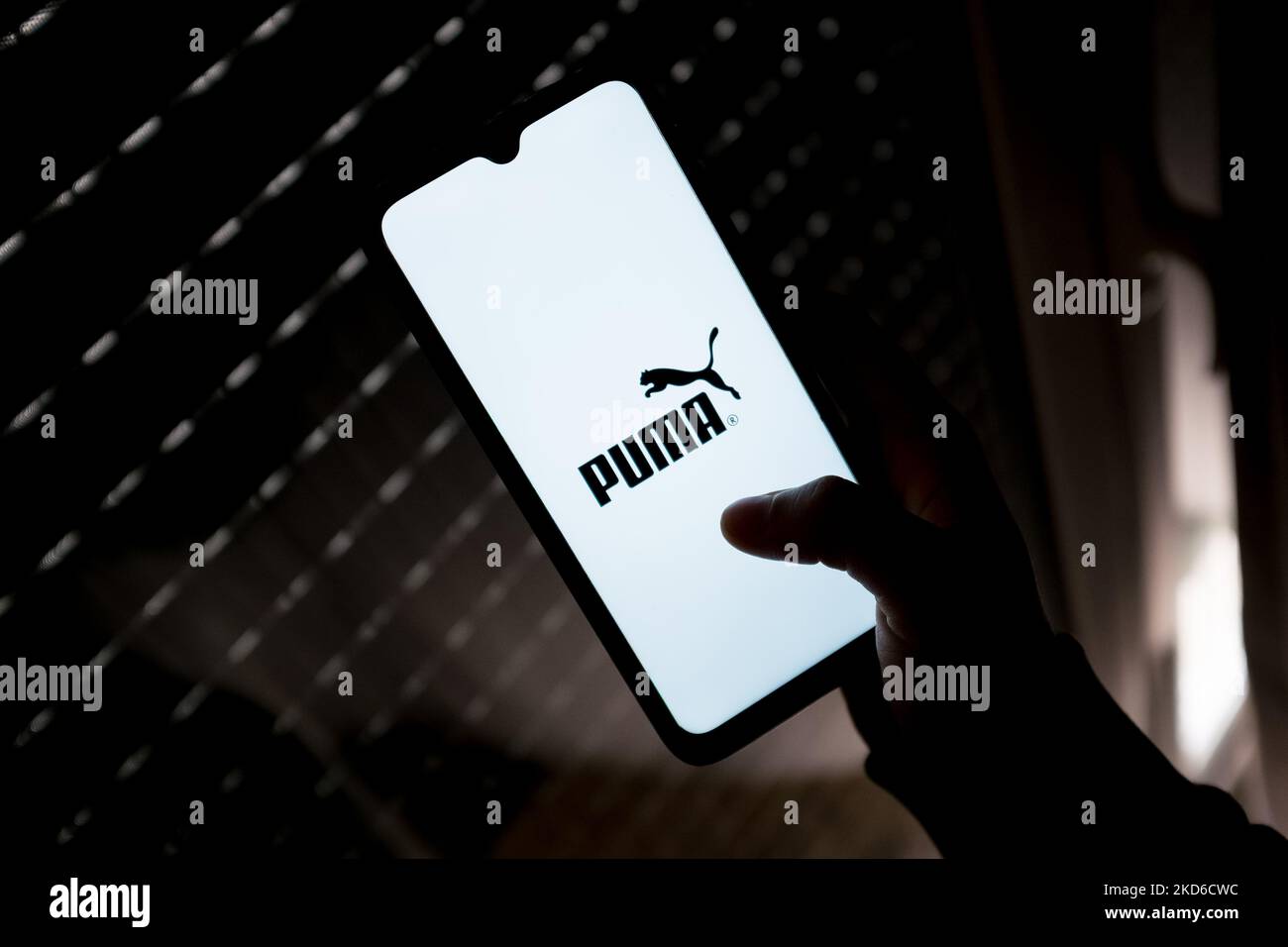 In this photo illustration a Puma logo seen displayed on a smartphone screen in Athens, Greece on March 30, 2022. (Photo by Nikolas Kokovlis/NurPhoto) Stock Photo