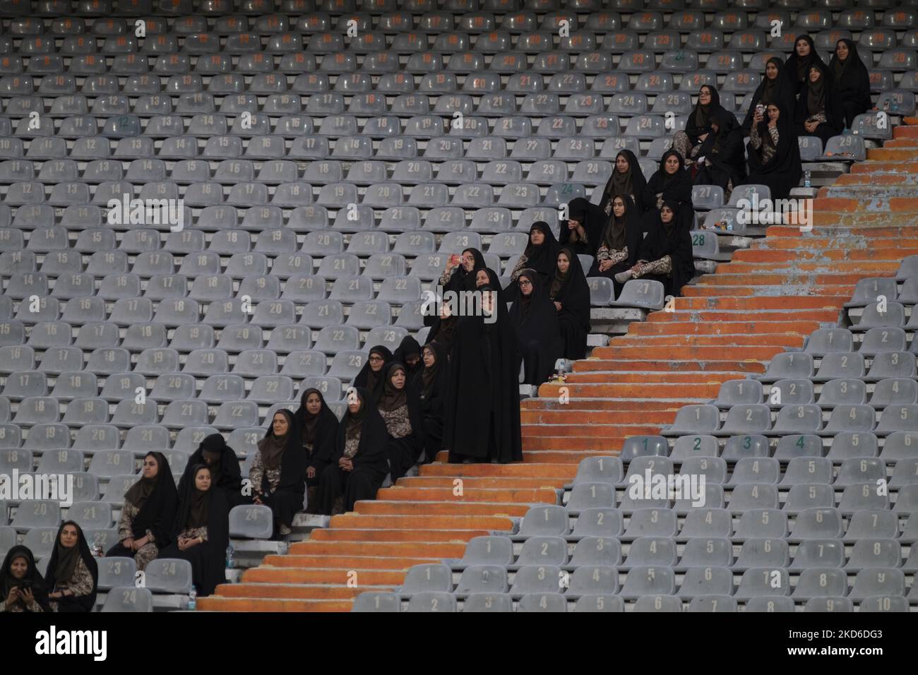 Iranian female security personnels sit at the Azadi (Freedom) stadium in western Tehran, October 10, 2019. Despite the Iranian sports ministry making tickets for Iranian female soccer fans for the March 29th match between Iran and Lebanon, they were denied entry, making the Iranian football federation fear they will be banned from the 2022 World Cup in Qatar. (Photo by Morteza Nikoubazl/NurPhoto) Stock Photo