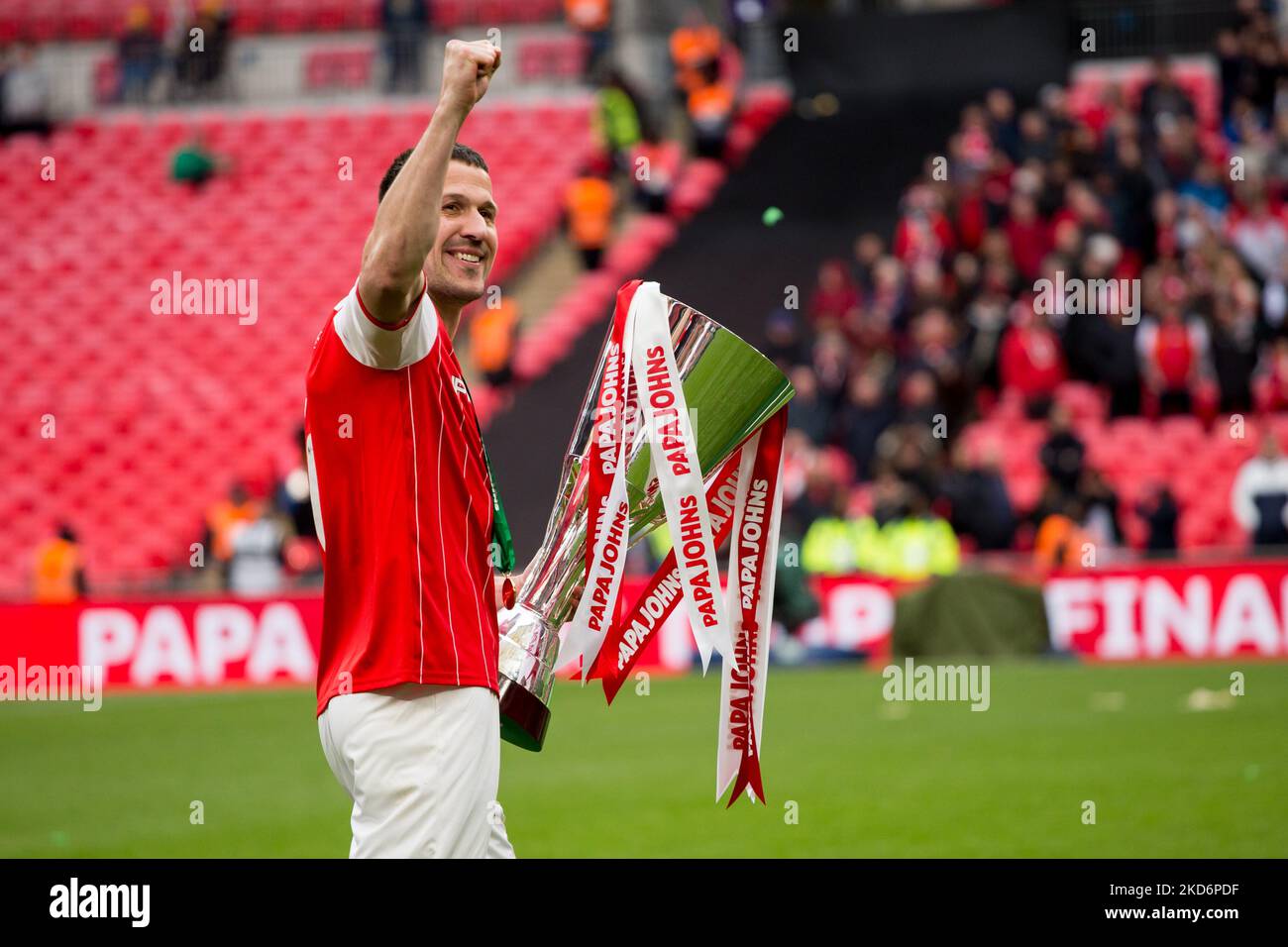 Richard Wood of Rotherham United looks the trophy during the Papa John