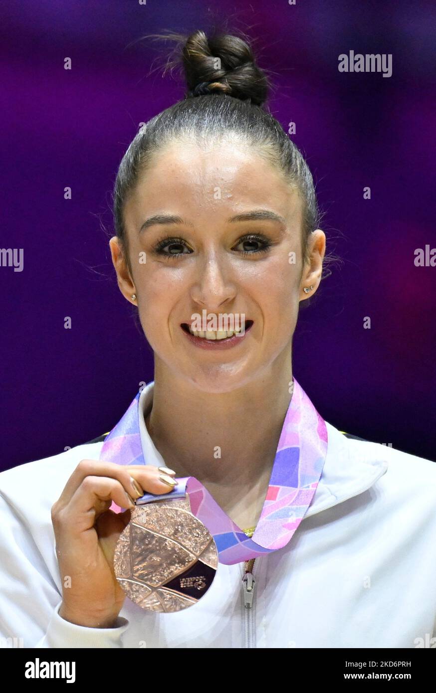 Belgian Nina Derwael celebrates her bronze medal on the podium of the