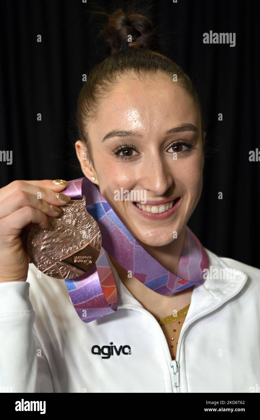 Belgian Nina Derwael celebrates her bronze medal on the podium of the