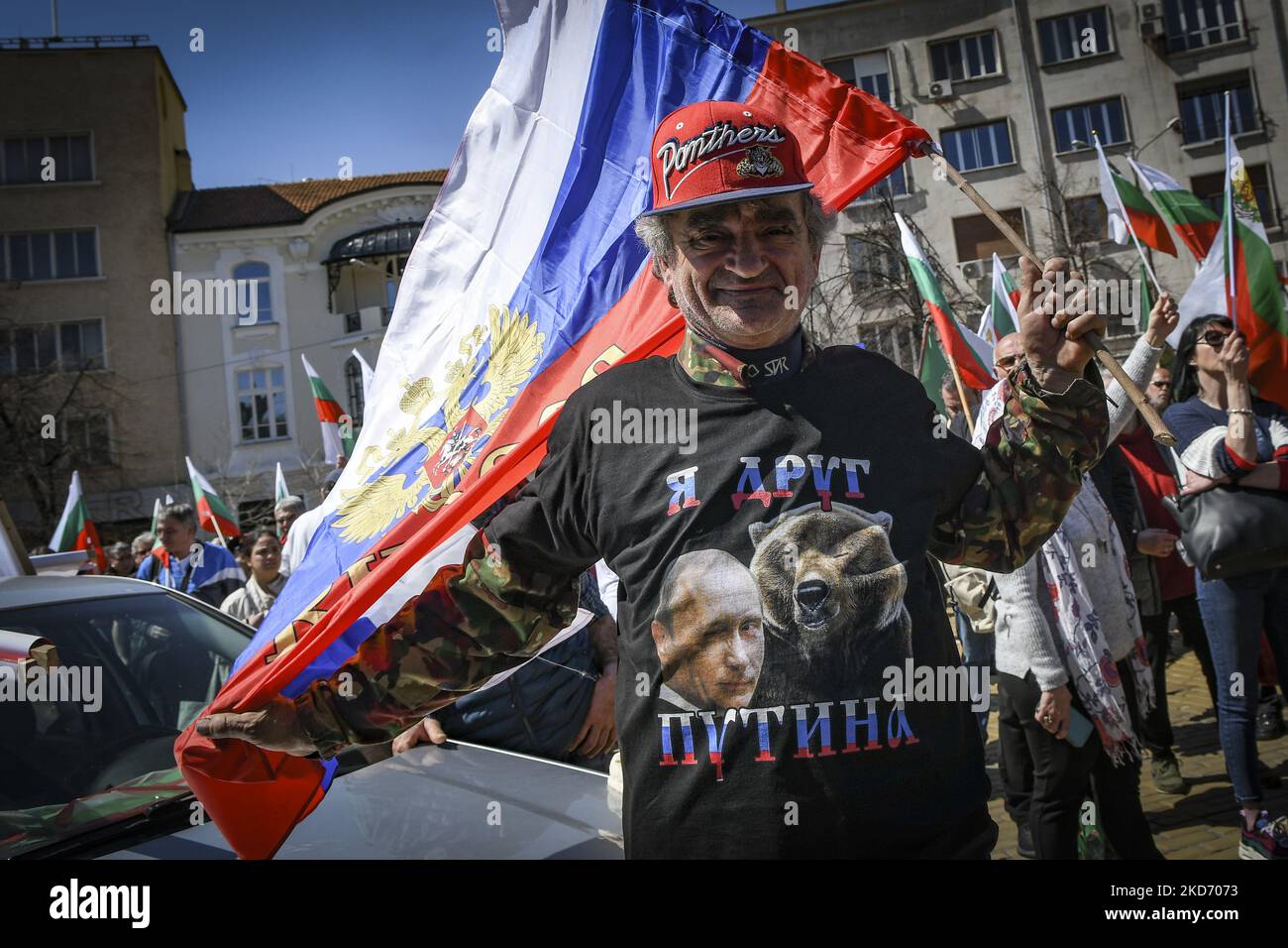 Man with t-shirt with Vladimir Putin waves Russian flag during protest of Nationalist and Russophile party of Vazrazhdane (Revival) in support of Russia and against Bulgaria's membership in NATO and sending weapons to Ukraine in front of Parliament Building in Sofia, Bulgaria on 06 April, 2022 (Photo by Georgi Paleykov/NurPhoto) Stock Photo