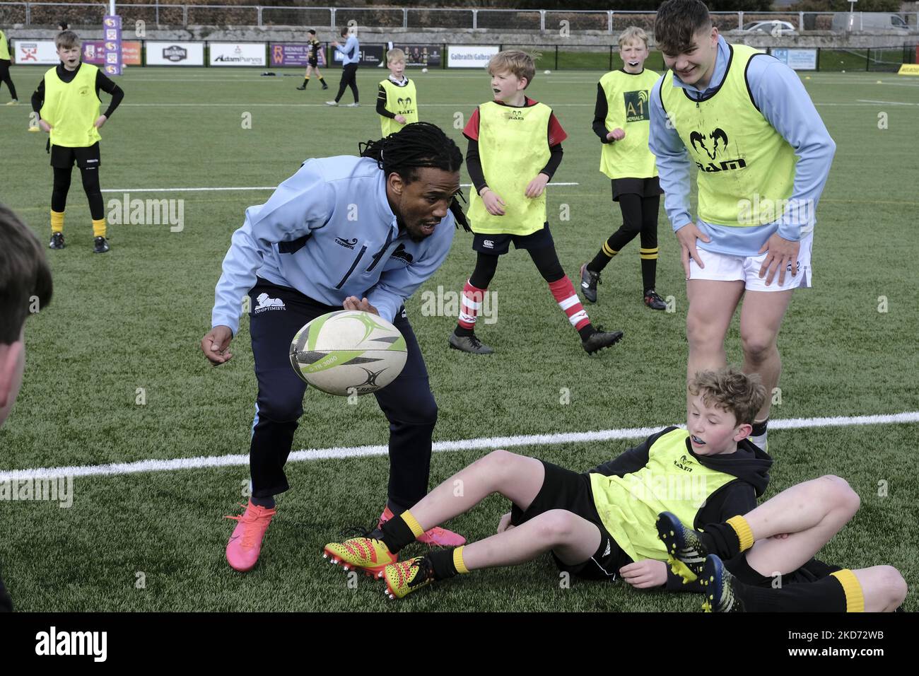 Cecil Africa along with members of the Co-Optimists squad help with coaching school pupils on Thursday 07 April 2022 ahead of the Melrose Sevens on Sat 9th April 2022. (Photo by Rob Gray/NurPhoto) Stock Photo