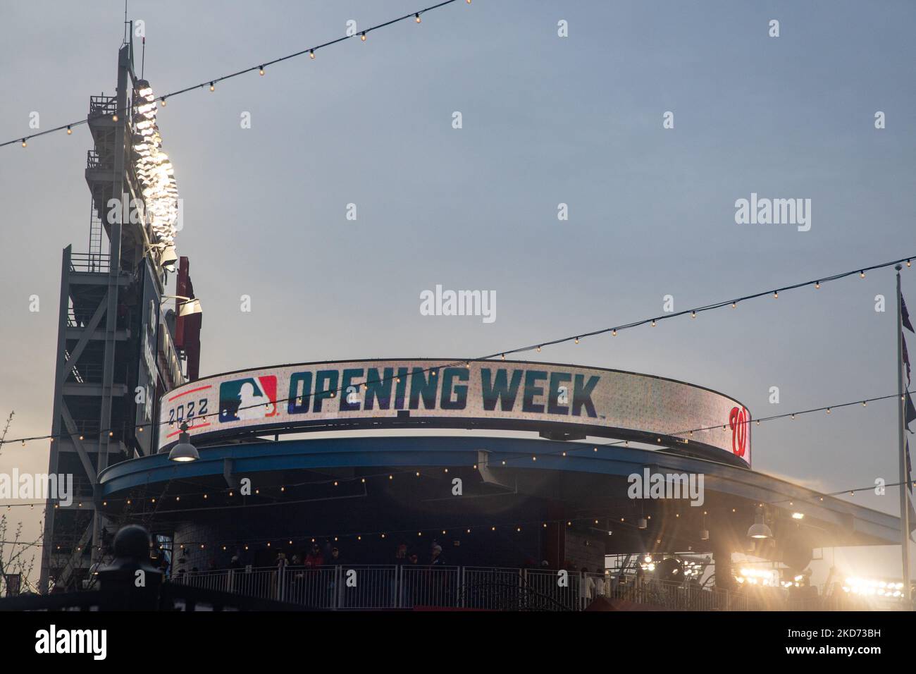 After a rain delay, fans gather to enter Nationals Park in Washington, D.C. for the Opening Day