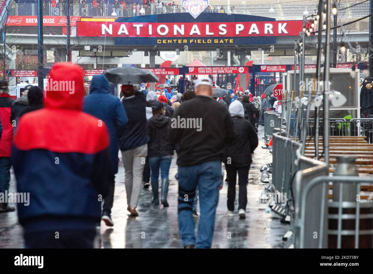 After a rain delay, fans gather to enter Nationals Park in Washington, D.C. for the Opening Day