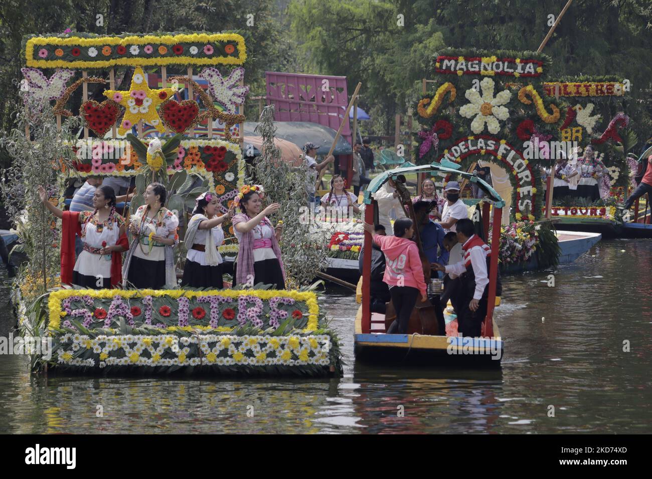 Representatives of La Flor Más Del Ejido in Xochimilco, Mexico City, aboard a canoe decorated with flowers during a tour of the Embarcadero Nuevo de Nativitas on the occasion of this contest, which aims to highlight the diversity of native women of this municipality, as well as to preserve and highlight the origins of the people who still preserve their customs and traditions. (Photo by Gerardo Vieyra/NurPhoto) Stock Photo