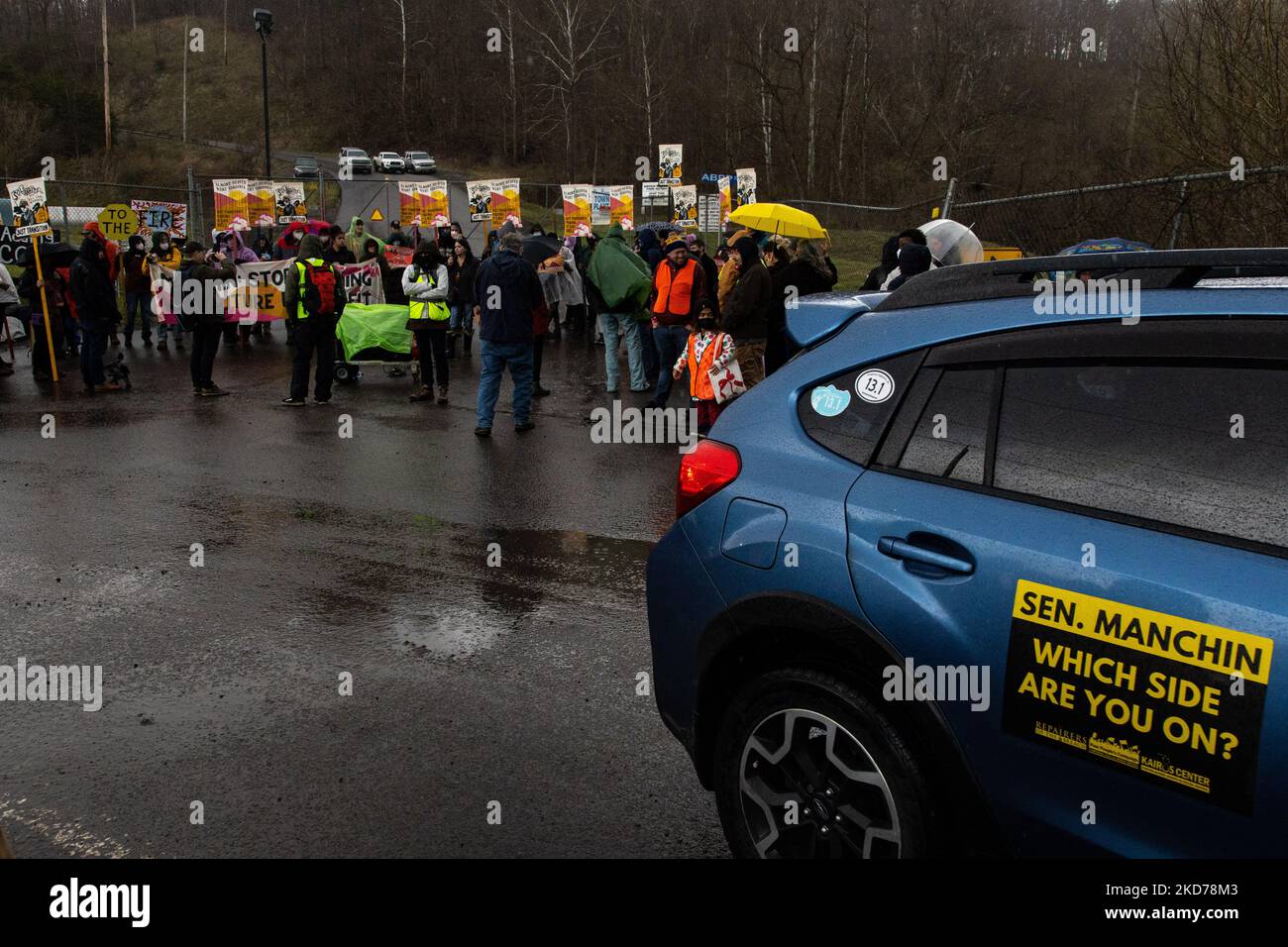 Climate activists gather to block the entrance to the Grant Town Power