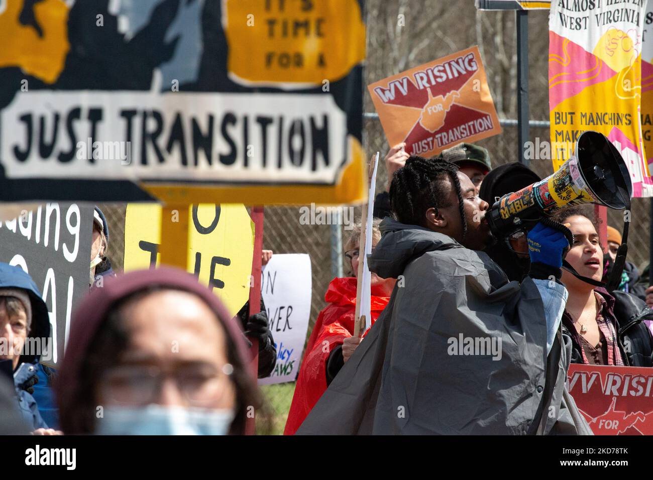 Climate activists gather to block the entrance to the Grant Town Power