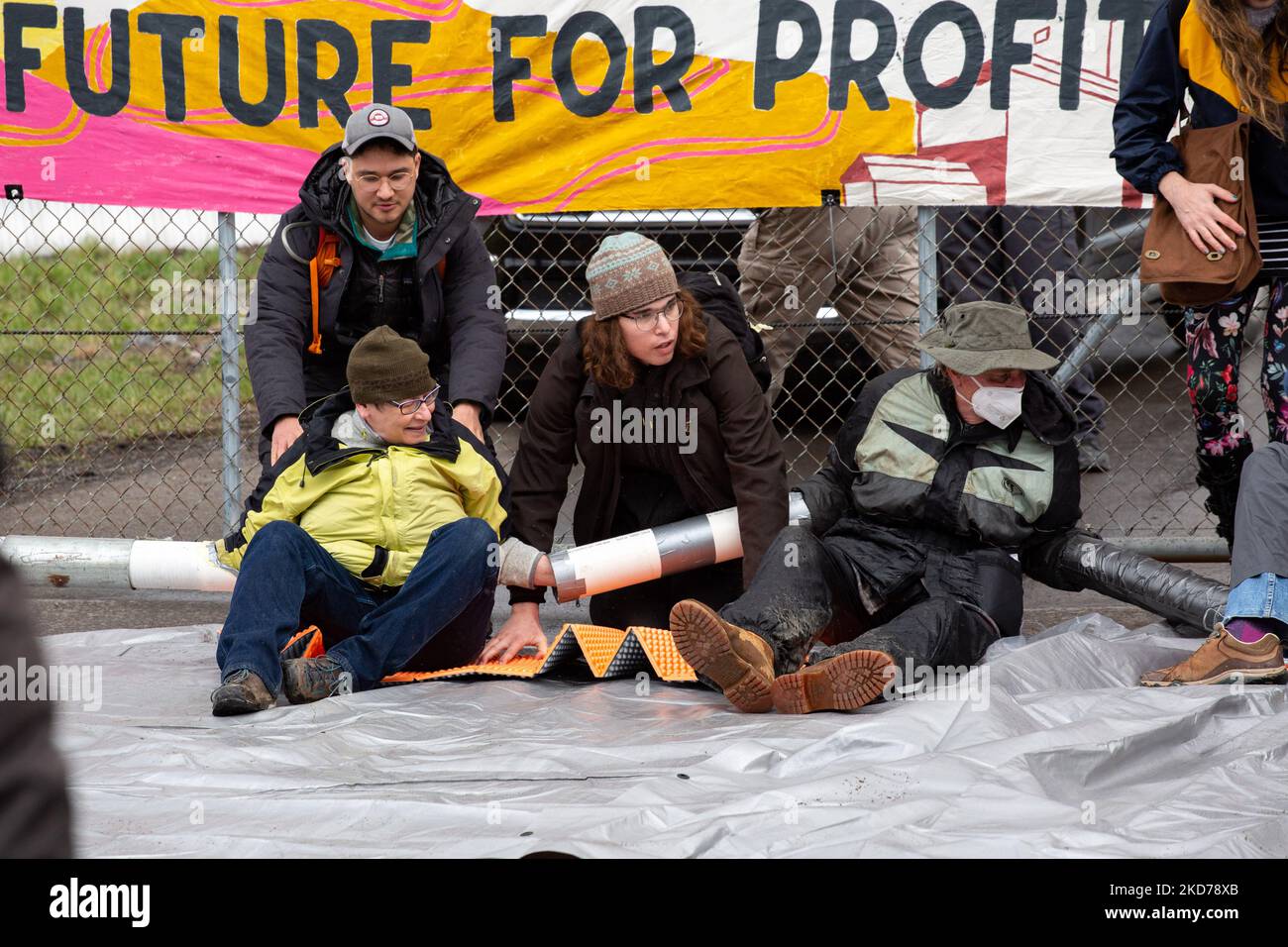 Climate activists gather to block the entrance to the Grant Town Power