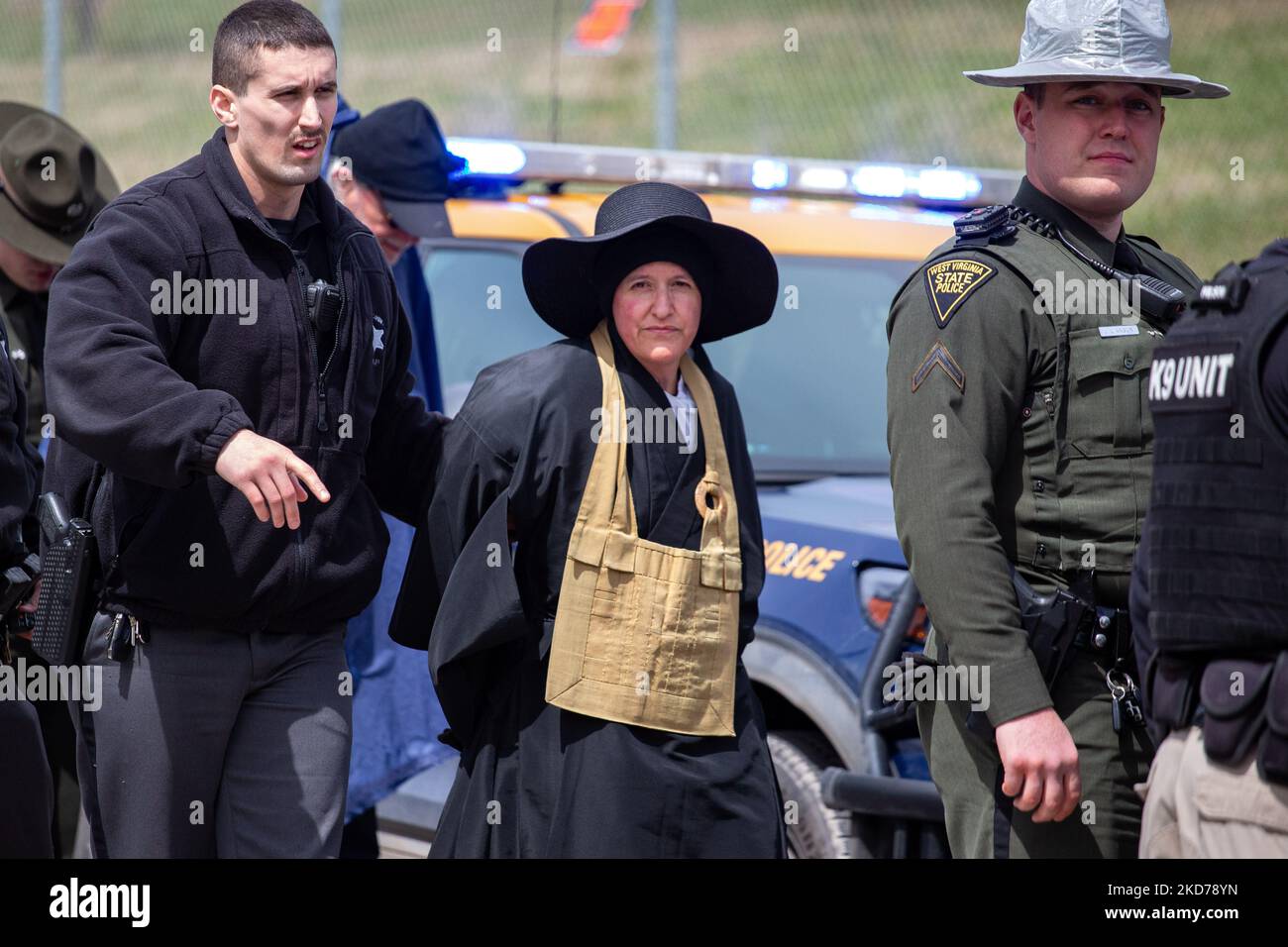Police arrest climate activists blocking the entrance to the Grant Town