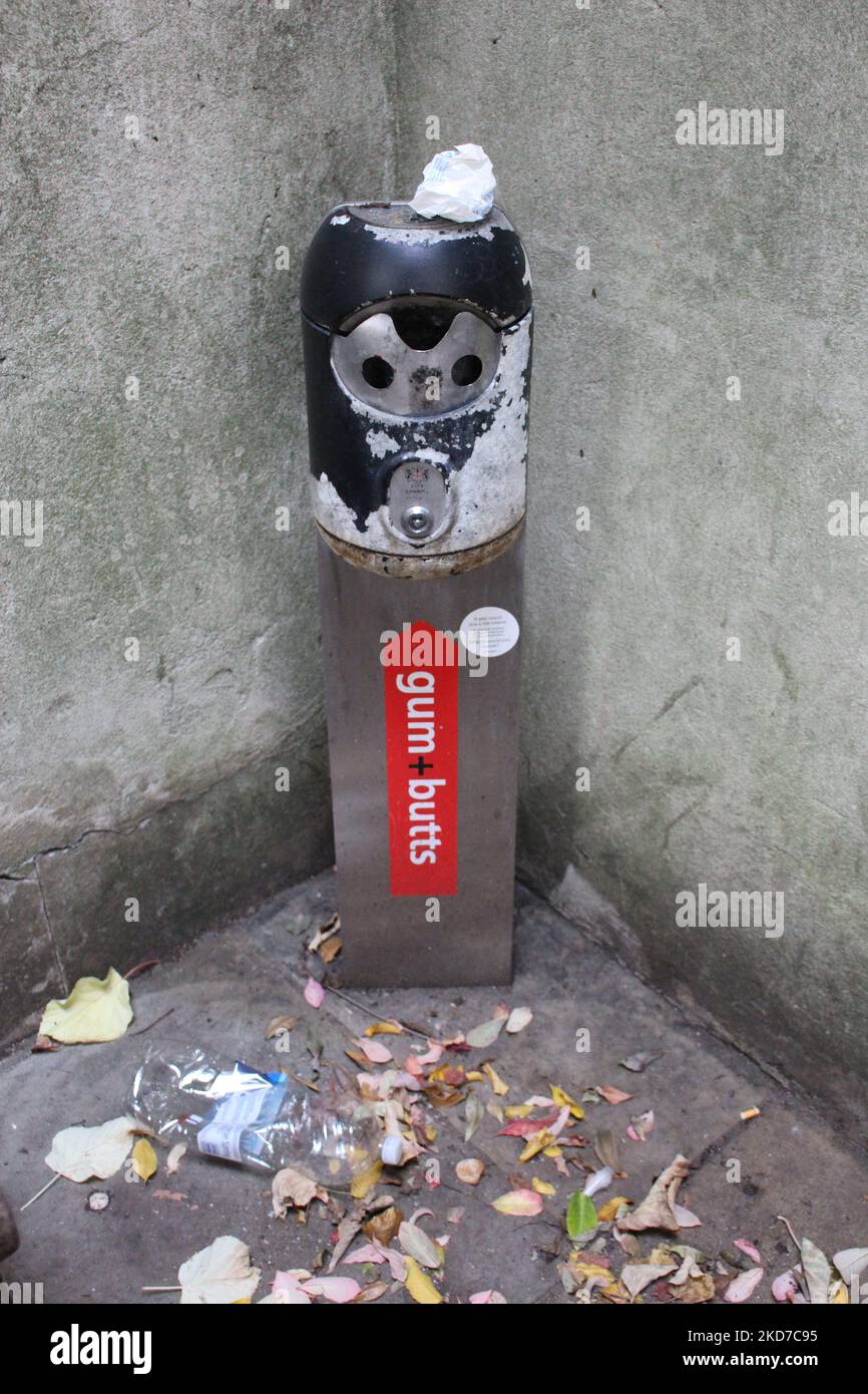 City of London Gum and Butts disposal point column in St Dunstan in the East Church Garden Stock Photo