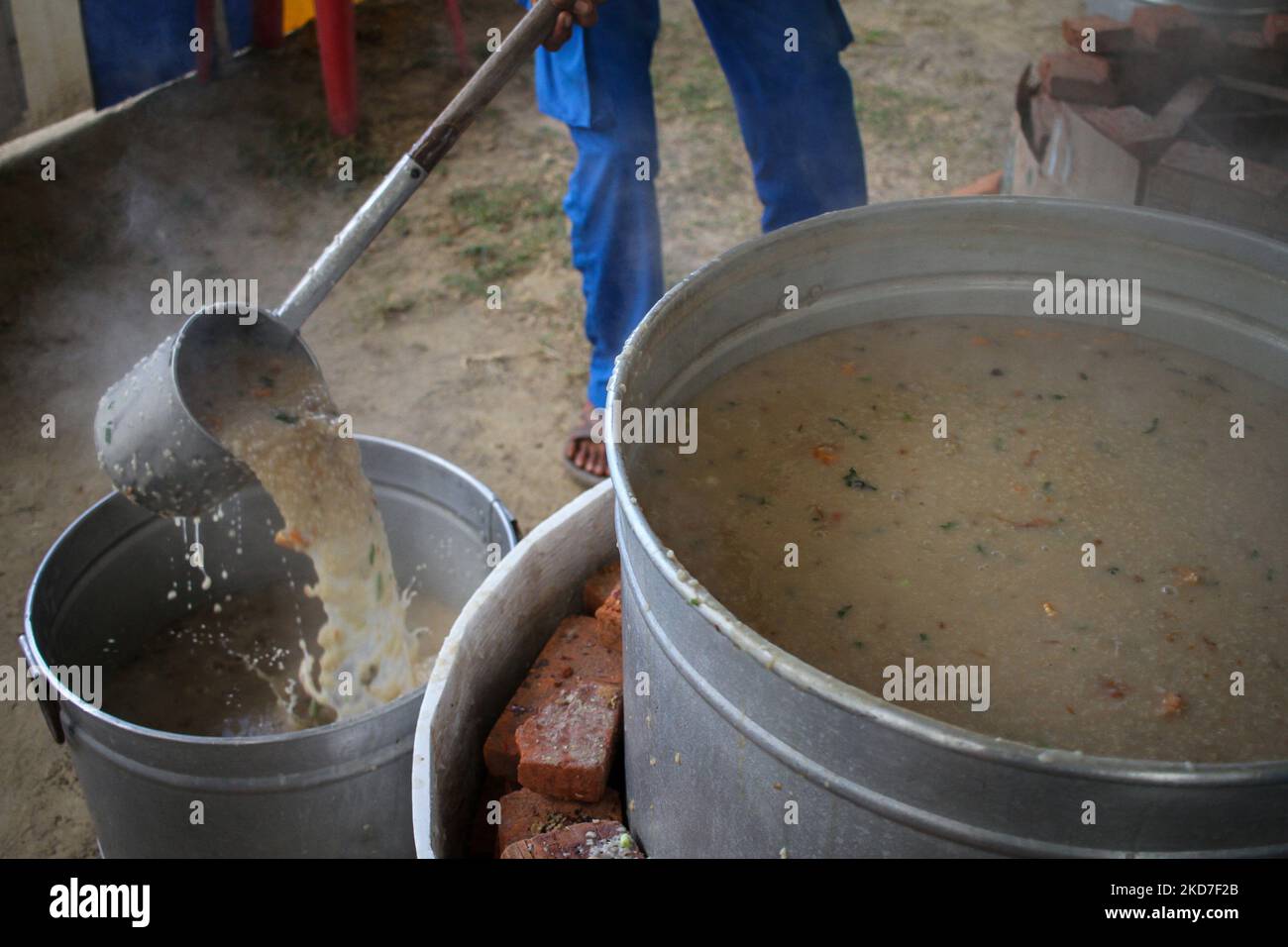 A mosque official makes a traditional dish called