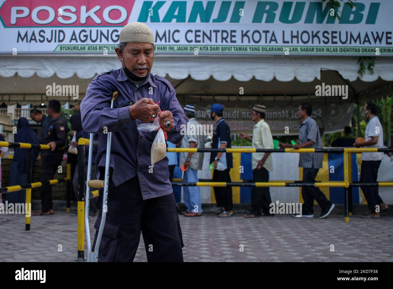 Muslims are seen queuing for a traditional dish called