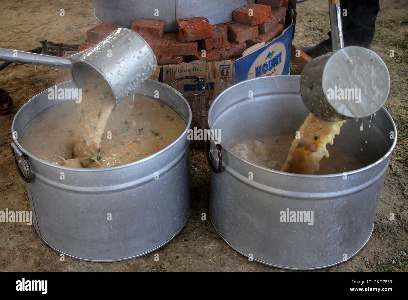 A mosque official makes a traditional dish called