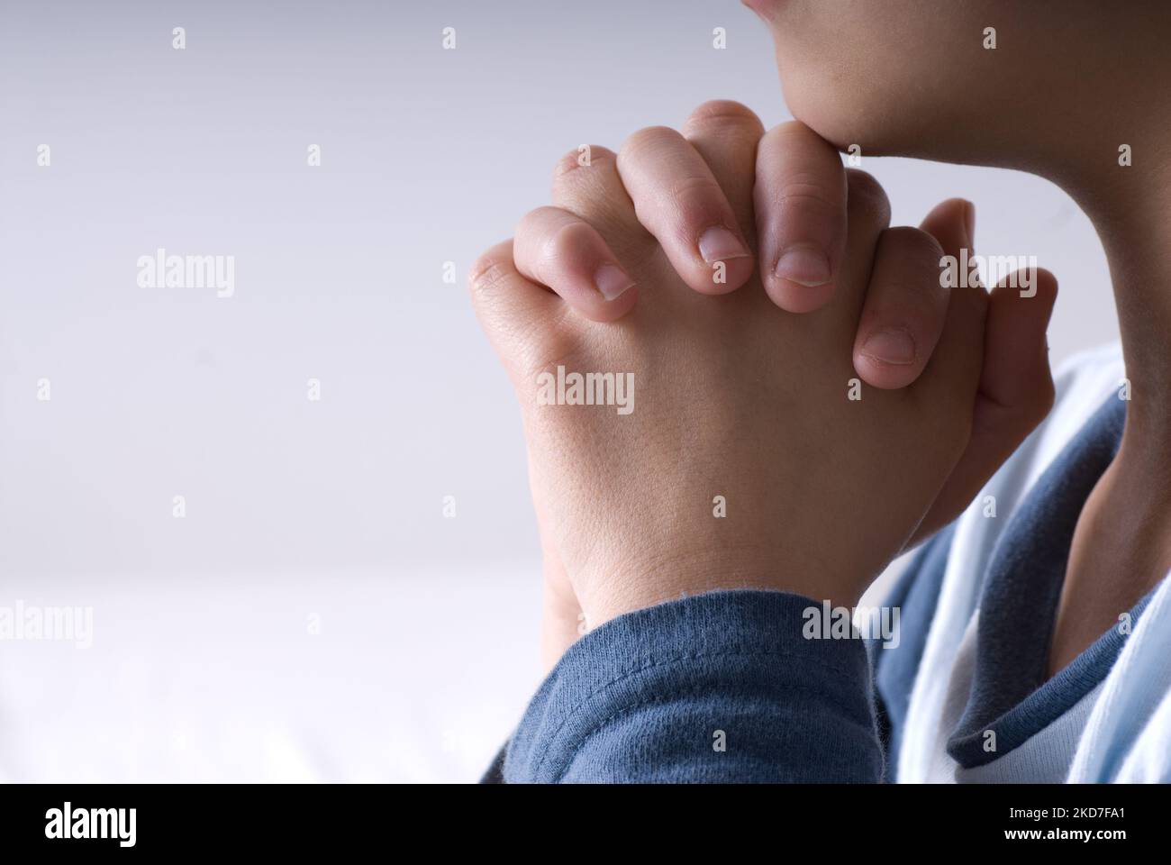 A closeup of a little boy praying before going to bed Stock Photo - Alamy