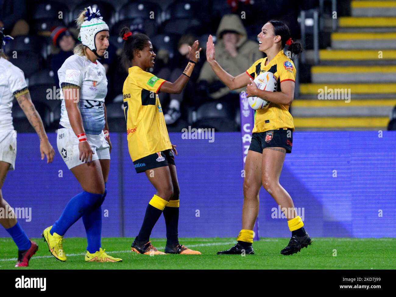 Papua New Guinea's Anika Butler (right) celebrates after scoring a try ...