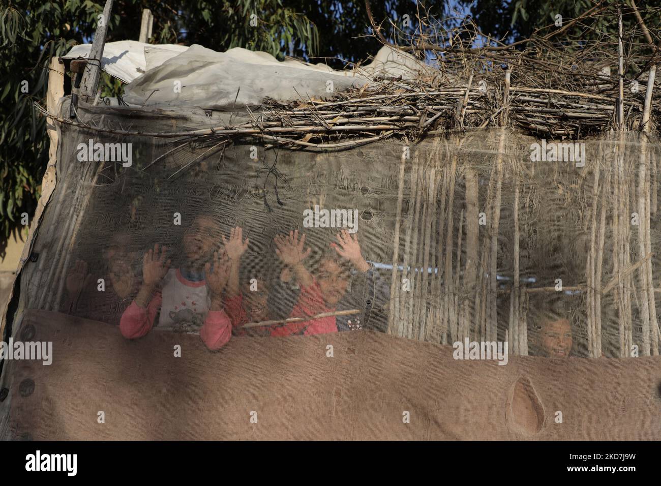 Palestinian children play next their house in Gaza City, on April 14, 2022. (Photo by Majdi Fathi/NurPhoto) Stock Photo