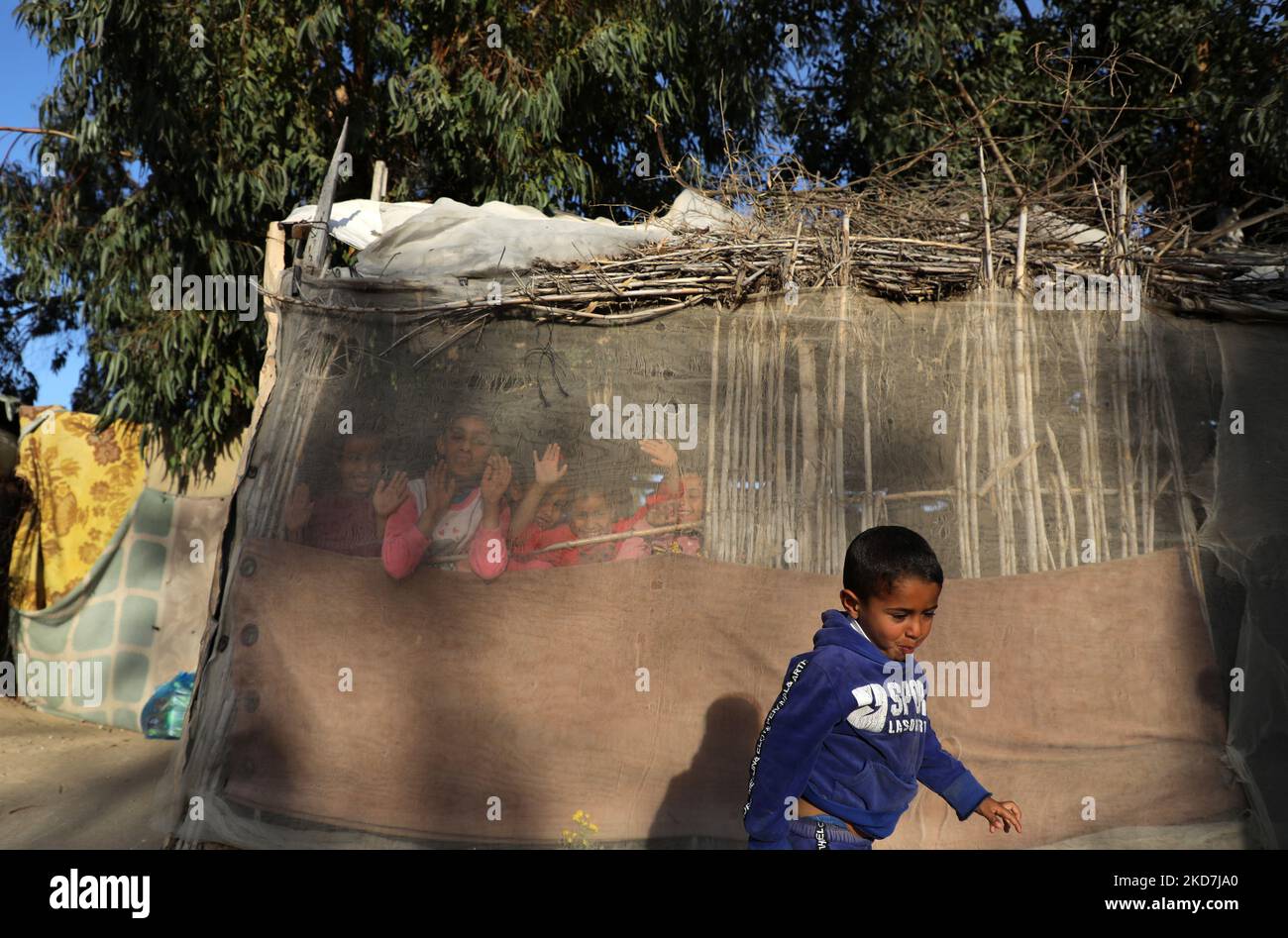 Palestinian children play next their house in Gaza City, on April 14, 2022. (Photo by Majdi Fathi/NurPhoto) Stock Photo