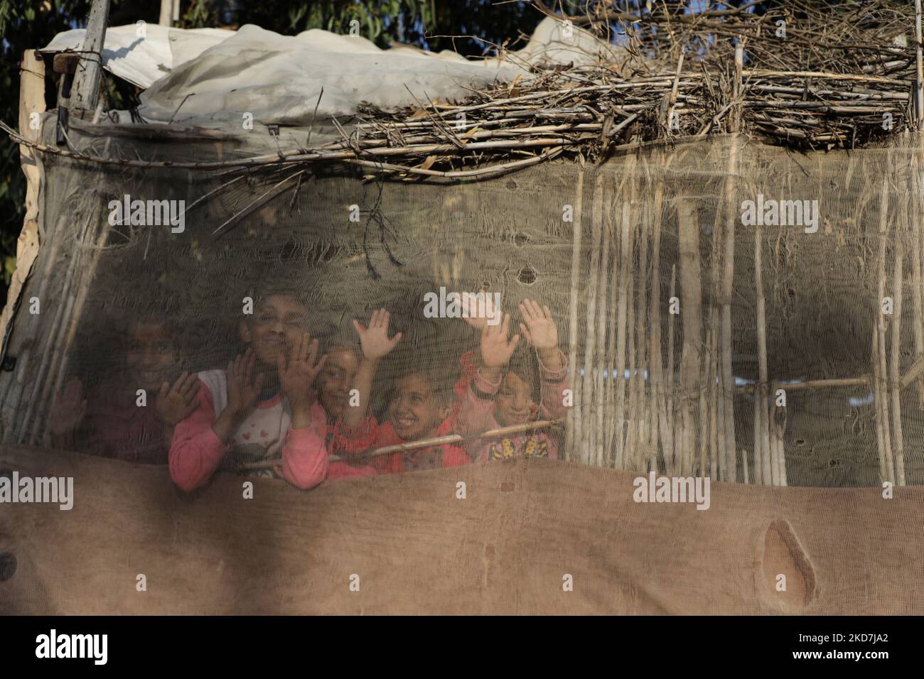 Palestinian children play next their house in Gaza City, on April 14, 2022. (Photo by Majdi Fathi/NurPhoto) Stock Photo