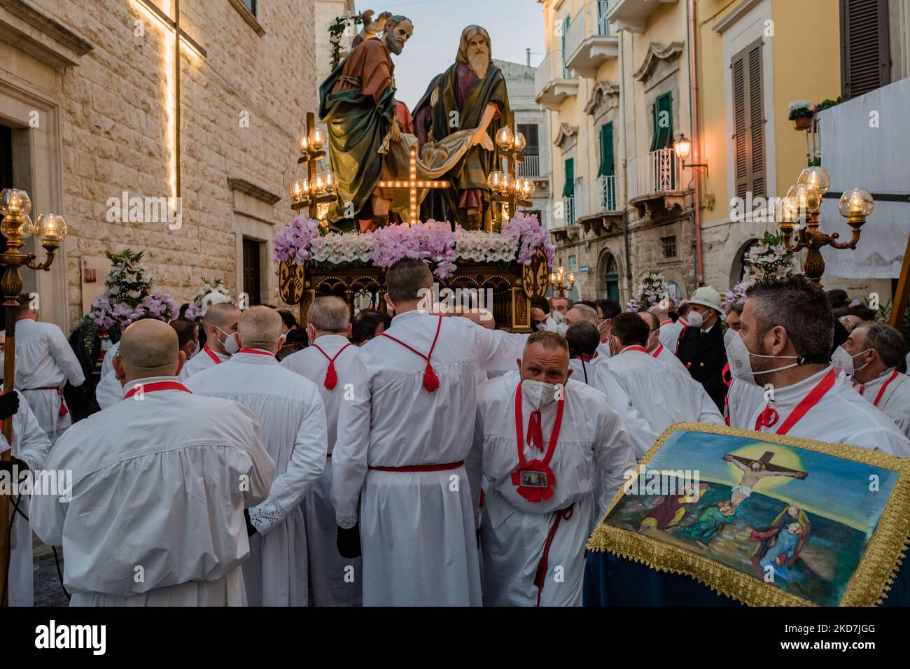 The Eight Saints, on Holy Thursday in procession in Ruvo di Puglia on April 14, 2022. After a two-year stop for the most acute phase of the Covid pandemic, the night of the Eight Saints has returned, as popular tradition calls the statuary group of the 'Transport of Christ to the Sepulcher', which, since 1920, has been conducted in procession by associates of the Confraternity Opera Pia San Rocco in Ruvo di Puglia, starting from the homonymous church where the statues are venerated. At 2 o'clock this night, Holy Thursday, in Piazza Menotti Garibaldi, the foot march took place by the 'N. Cassan Stock Photo