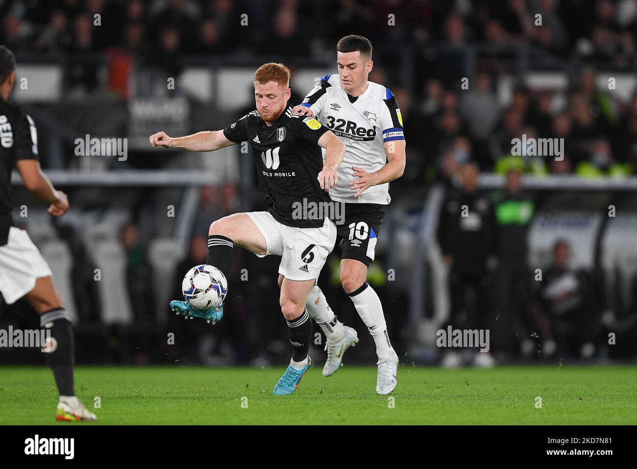 Harrison Reed of Fulham shields the ball from Tom Lawrence of Derby County during the Sky Bet Championship match between Derby County and Fulham at the Pride Park, Derby on Friday 15th April 2022. (Photo by Jon Hobley/MI News/NurPhoto) Stock Photo