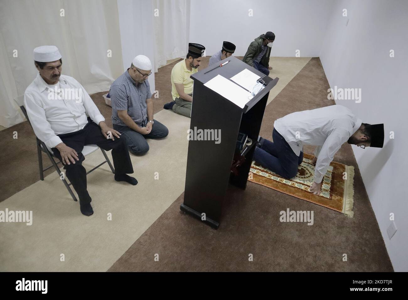 Members of the Muslim community inside a mosque in Mexico City during prayer after fasting as part of Ramadan in order to grow spiritually and establish stronger relationships with Allah. (Photo by Gerardo Vieyra/NurPhoto) Stock Photo