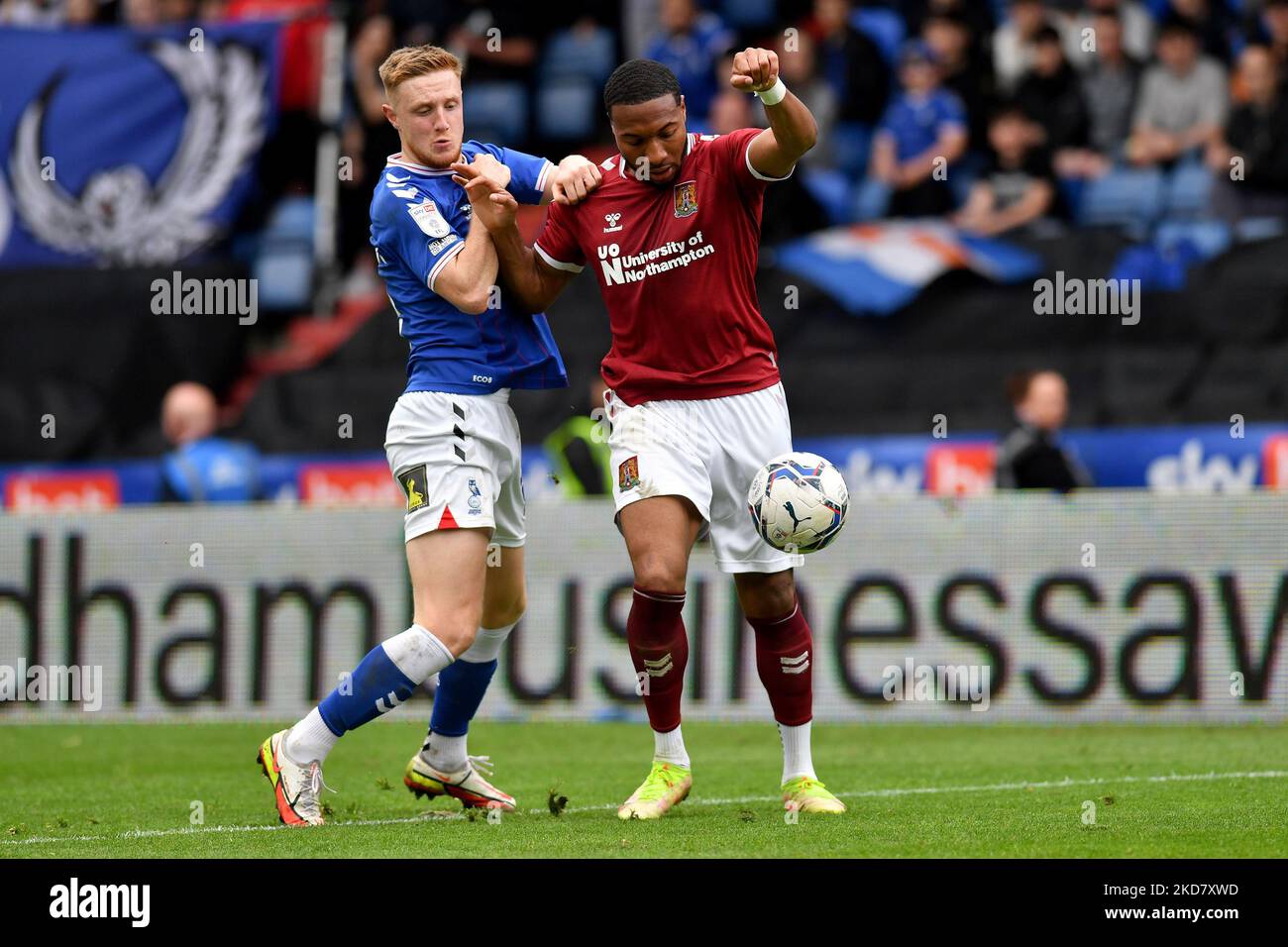 Oldham Athletic's Davis Keillor-Dunn tussles with Ali Koiki of Northampton Town during the Sky Bet League 2 match between Oldham Athletic and Northampton Town at Boundary Park, Oldham on Friday 15th April 2022. (Credit: Eddie Garvey | MI News) (Photo by MI News/NurPhoto) Stock Photo