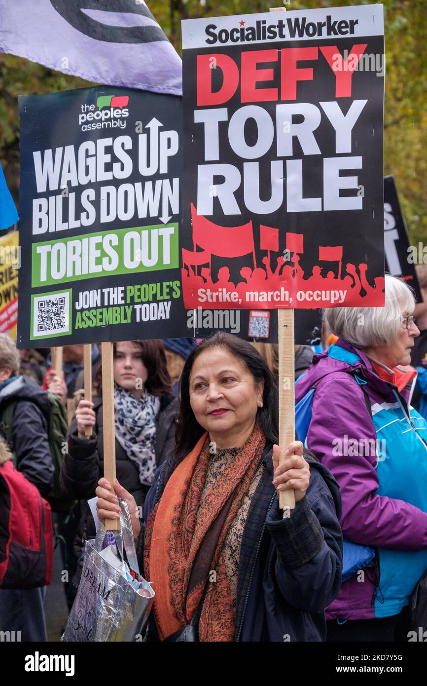 London, UK. 5 Nov 2022. Woman with Defy Tory Rule placard.Many groups joined the People's Assembly Against Austerity in their march around Westminster to a rally in Trafalgar Square. They say 'Britain Is Broken' and demand a General Election Now! Among the marchers were many trade unionists, left groups and Labour supporters including Jeremy Corbyn and John McDonnell. Peter Marshall/Alamy Live News Stock Photo
