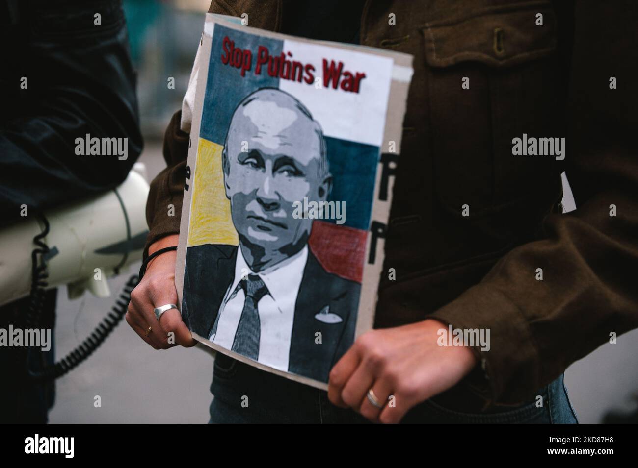 a sign of ' stop putins war' is seen during the antiwar protest from students of Bonn university in Bonn, Germany on April 22, 2022 (Photo by Ying Tang/NurPhoto) Stock Photo