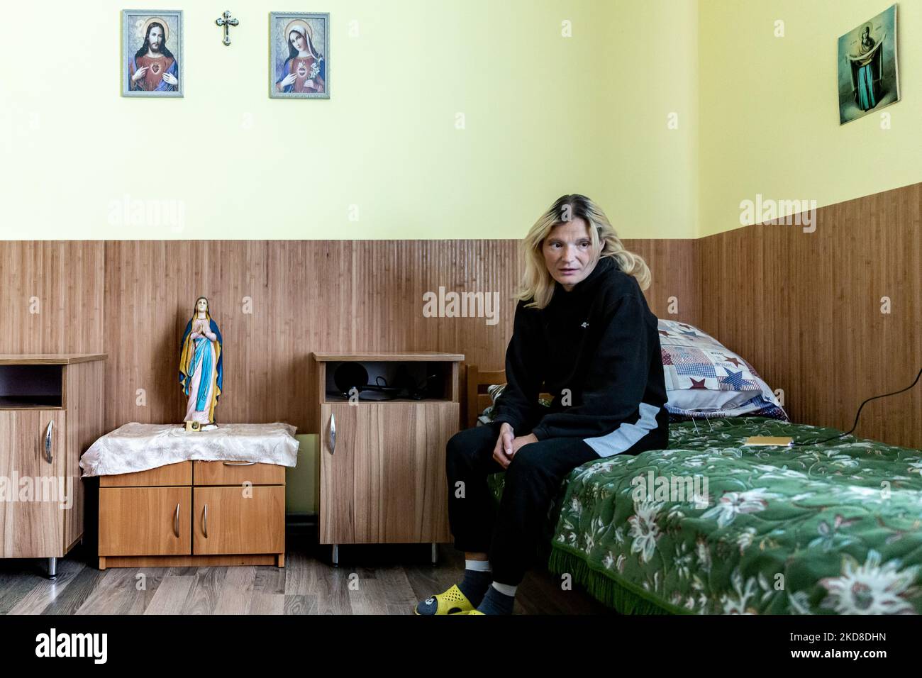 A Ukrainian woman with learning disabilities rests in a her room in a Center for women and girls with learning disabilities run by Greek Catholic church in Bukova, Lviv Oblast Ukraine on April 25, 2022. As the Russian Federation invaded Ukraine two months ago, the conflict caused that places like the Centre in Bukova become even more isolated and underfunded. (Photo by Dominika Zarzycka/NurPhoto) Stock Photo