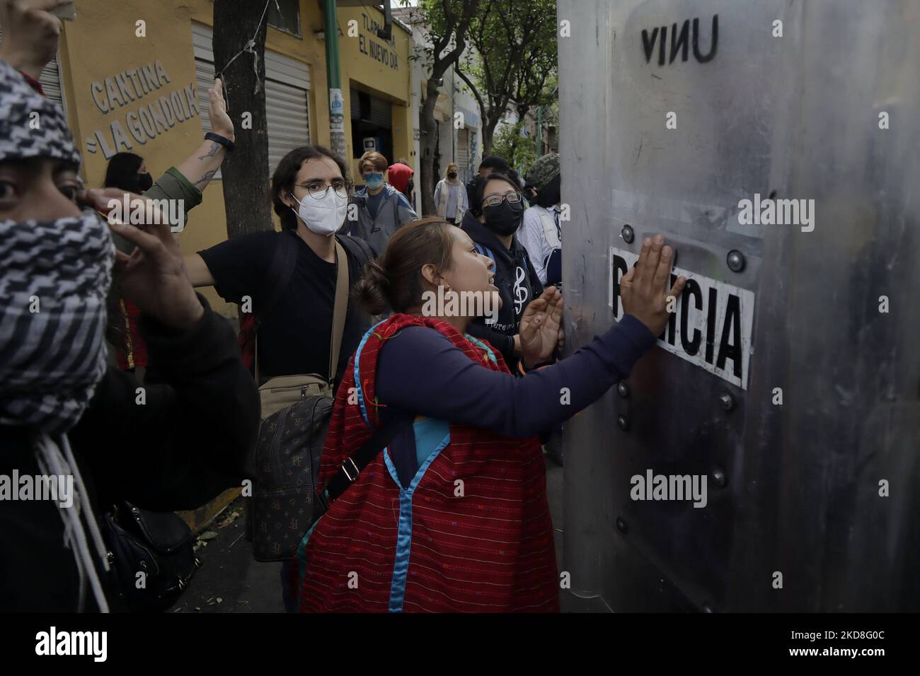 A member of the Triqui community of Copala, Oaxaca, clashes with police while they are encapsulated after being evicted from an encampment they had maintained for 15 months on Avenida Juárez, Mexico City. After these events, they were once again encapsulated outside a building that gave them refuge for one night in the street of Mapimí and Plomo, in the Valle Gómez neighbourhood. (Photo by Gerardo Vieyra/NurPhoto) Stock Photo