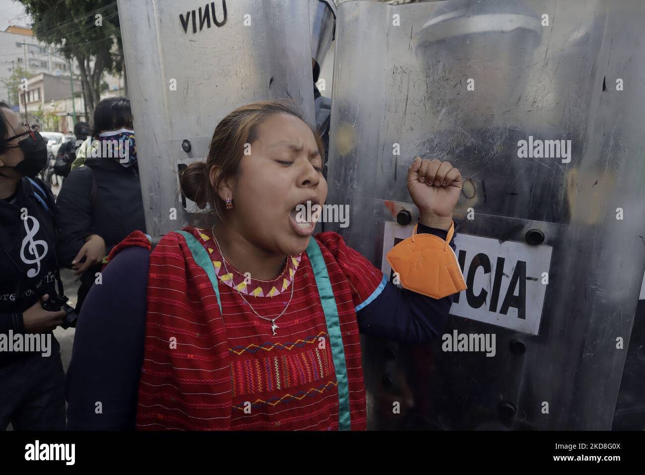 A member of the Triqui community of Copala, Oaxaca, clashes with police while they are encapsulated after being evicted from an encampment they had maintained for 15 months on Avenida Juárez, Mexico City. After these events, they were once again encapsulated outside a building that gave them refuge for one night in the street of Mapimí and Plomo, in the Valle Gómez neighbourhood. (Photo by Gerardo Vieyra/NurPhoto) Stock Photo