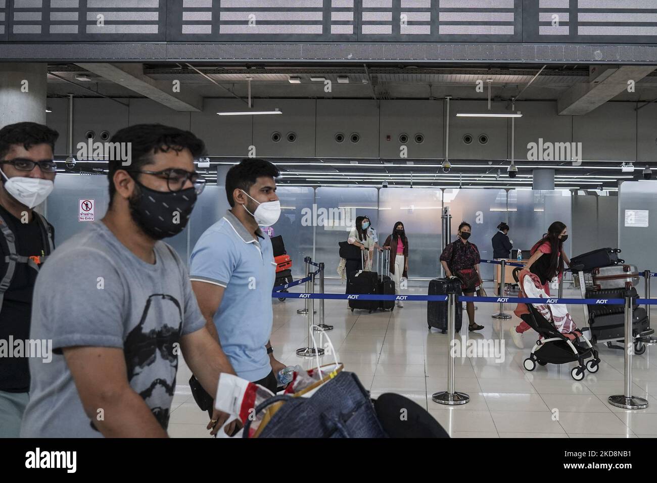Tourists wearing face masks as a preventive measure against the spread