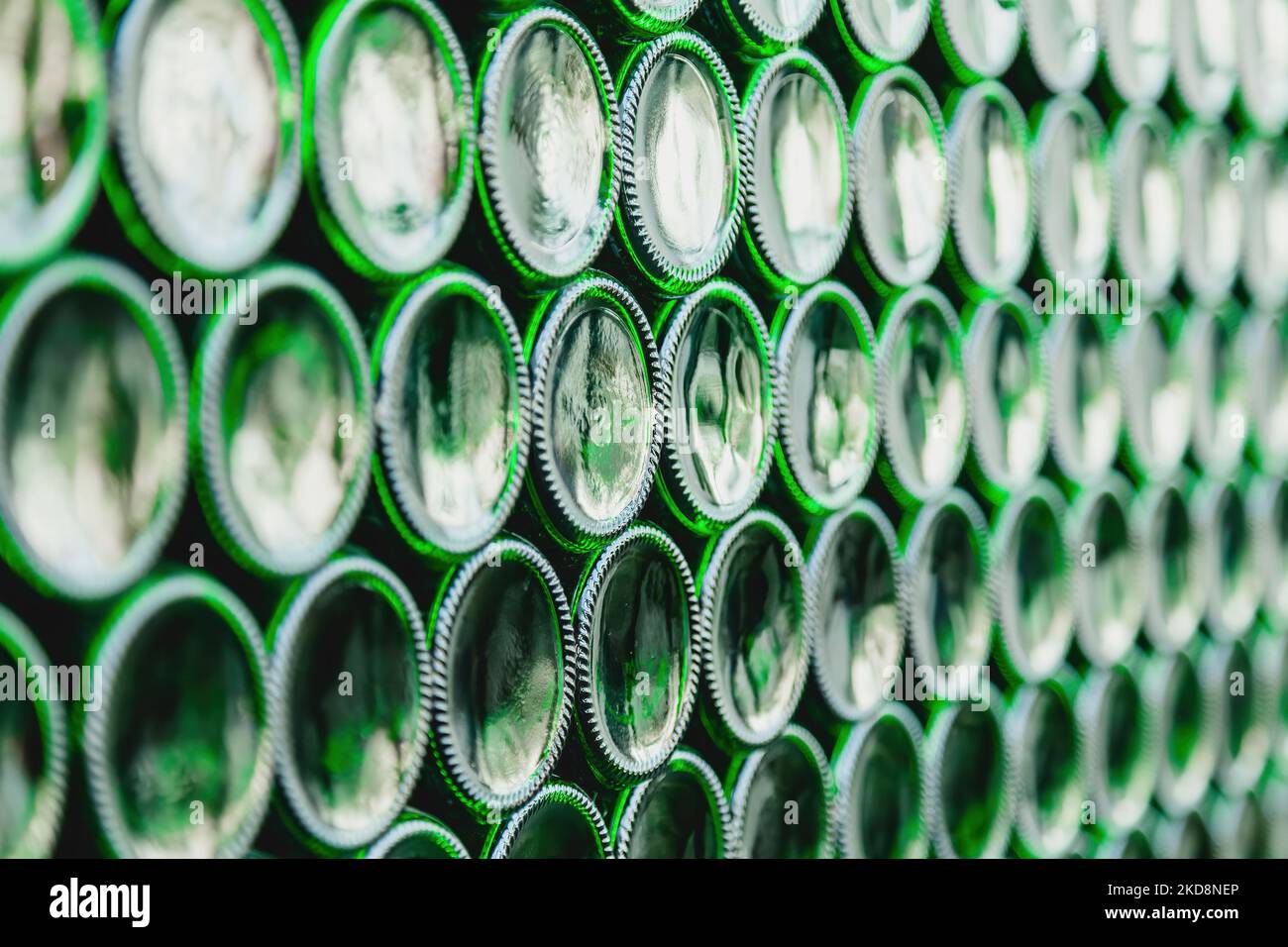 Glass bottles green. Green glass bottles of beer. Wall formed by green