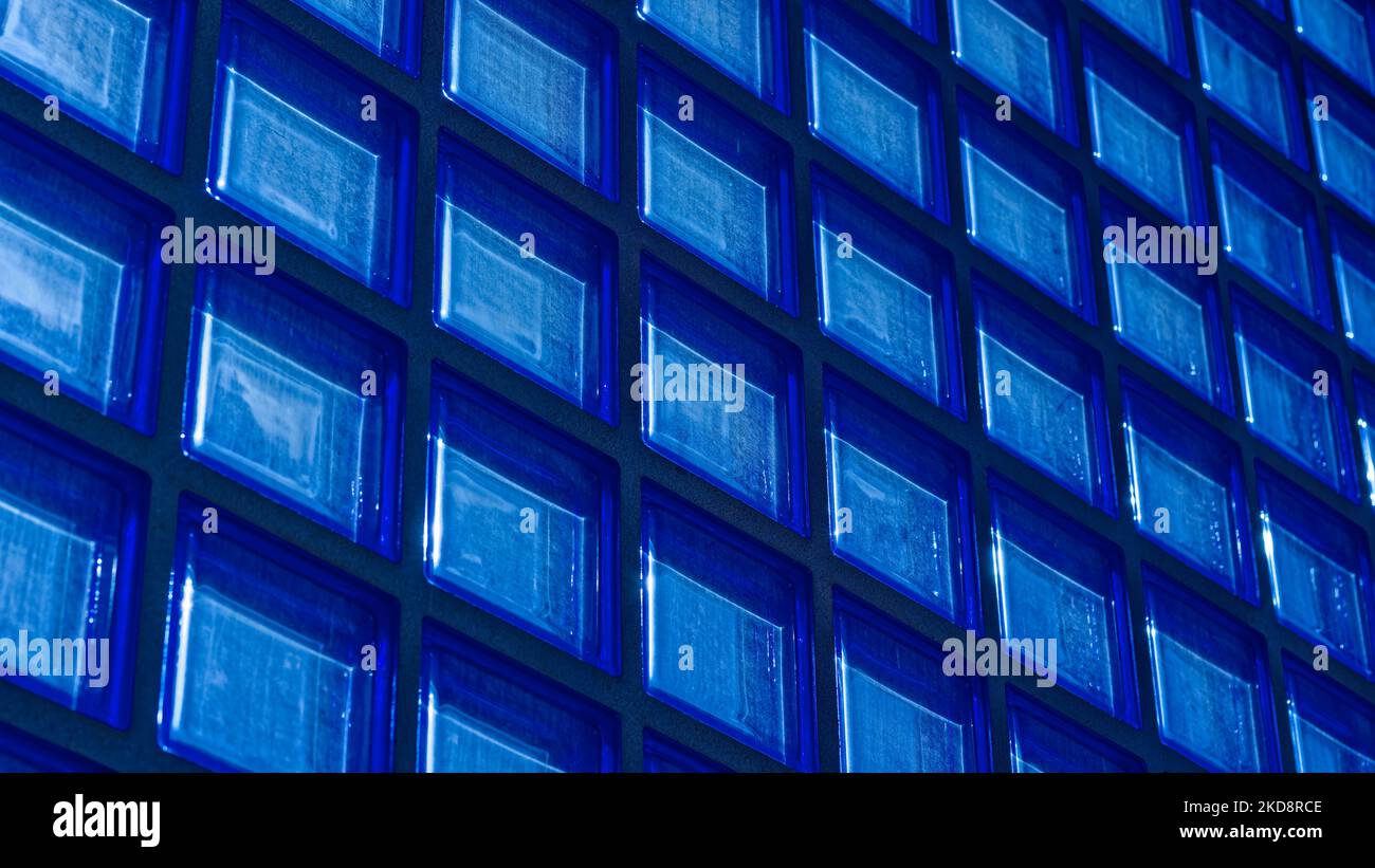 Blue colored glass block corridor wall Stock Photo