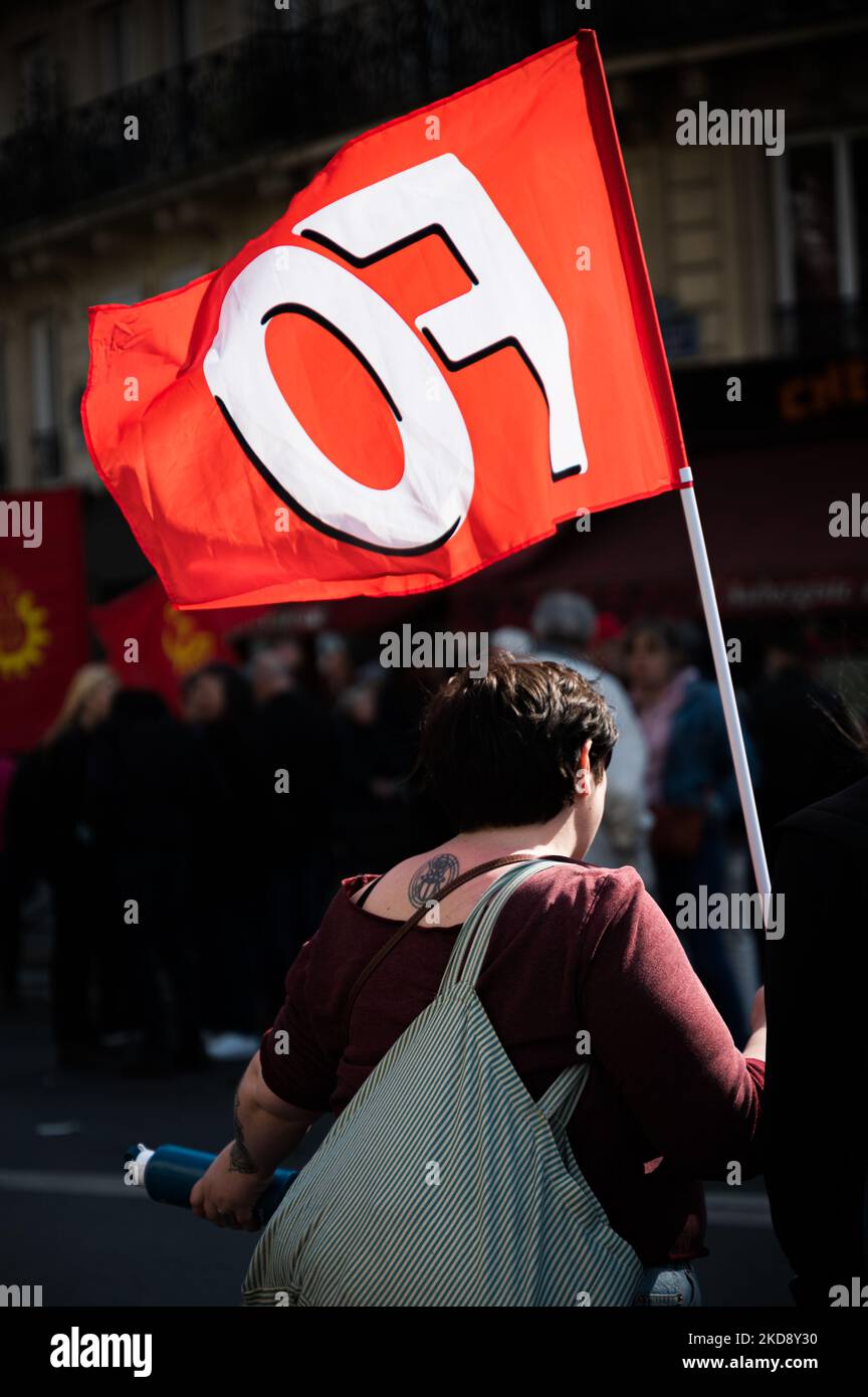 An activist holds a red FO flag of the trade union Force Ouvrière during the traditional May Day demonstration in Paris (Labour Day) marking International Workers' Day, starting from the Place de la République in Paris, May 1, 2022. (Photo by Samuel Boivin/NurPhoto) Stock Photo
