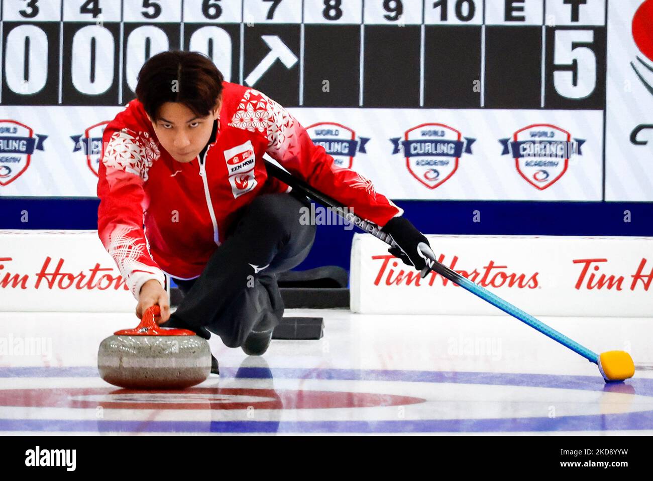 Japan skip Yanagisawa Riku makes a shot during semifinal playoff action against Canada at the Pan Continental Curling Championships in Calgary, Alberta, Saturday, Nov