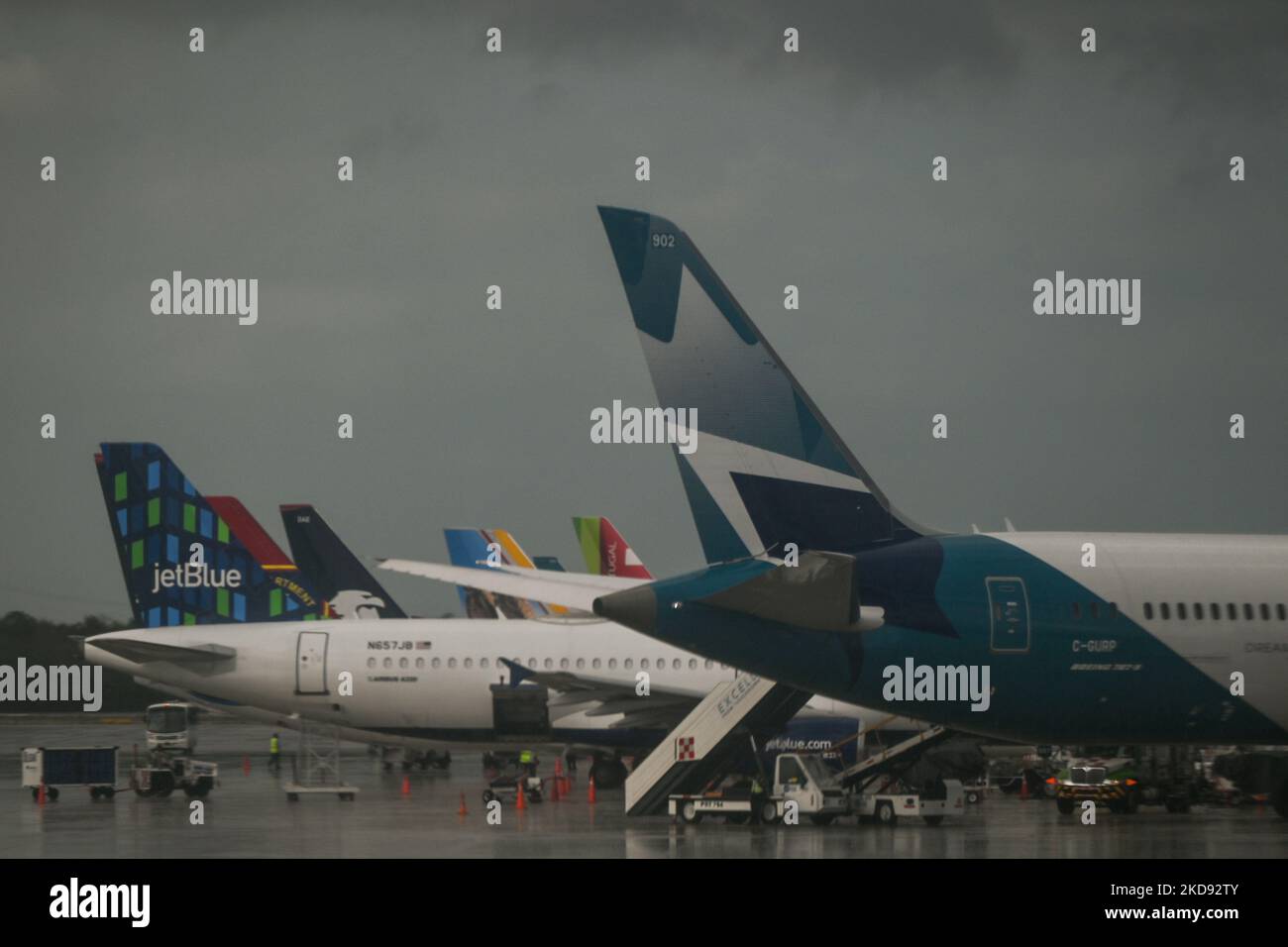 Logos of JetBlue and WestJet seen at Cancun International Airport. On Monday, 30 April 2022, in Cancun International Airport, Cancun, Quintana Roo, Mexico. (Photo by Artur Widak/NurPhoto) Stock Photo