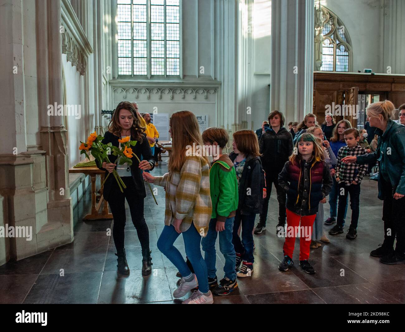 Children are receiving flowers to place later on the monuments in remember of the victims of WWII, during the Remembrance Day held again in Nijmegen, on May 4th, 2022. (Photo by Romy Arroyo Fernandez/NurPhoto) Stock Photo